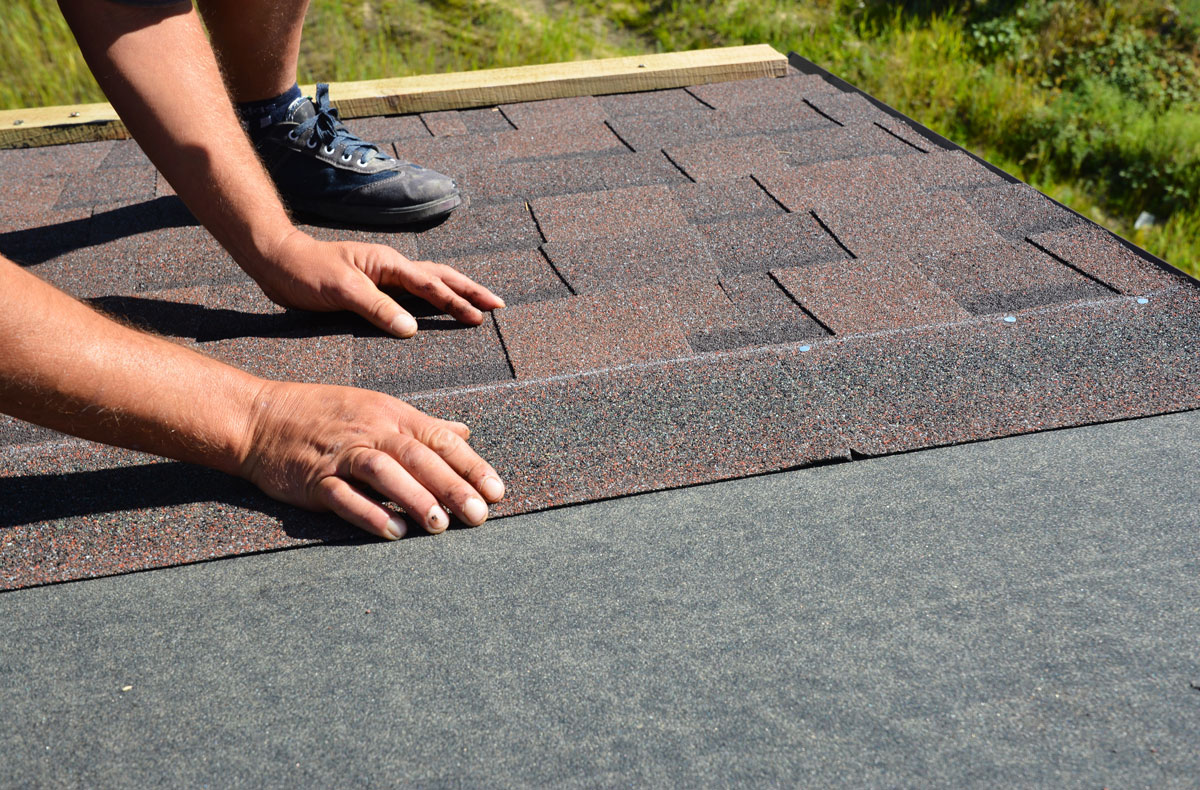 Raydiant Roofing Roofer Installing Shingles