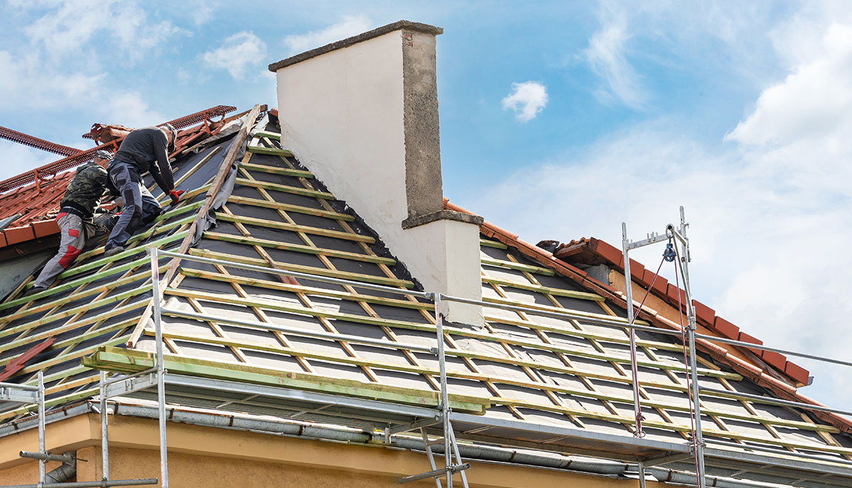 Roofers Installing Shingles on Commercial Roof