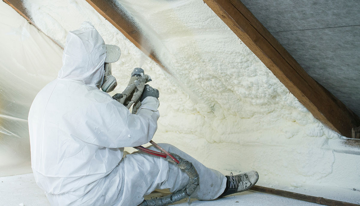 Expert Spraying Polyurethane Foam on House
