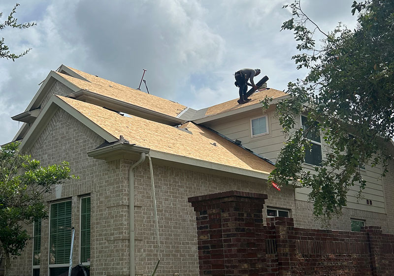 Roofers Installing Roof Shingles