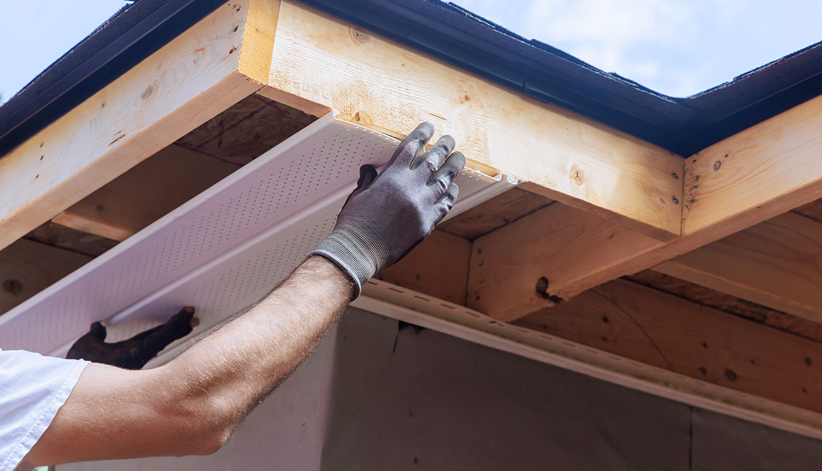 Roofer Repairing Soffit and Fascia
