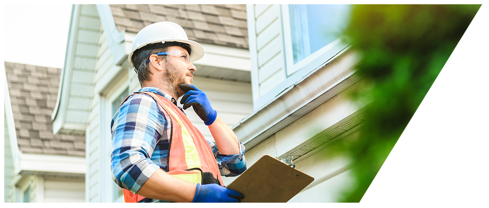 Expert Roofer Inspecting Roof Flashing